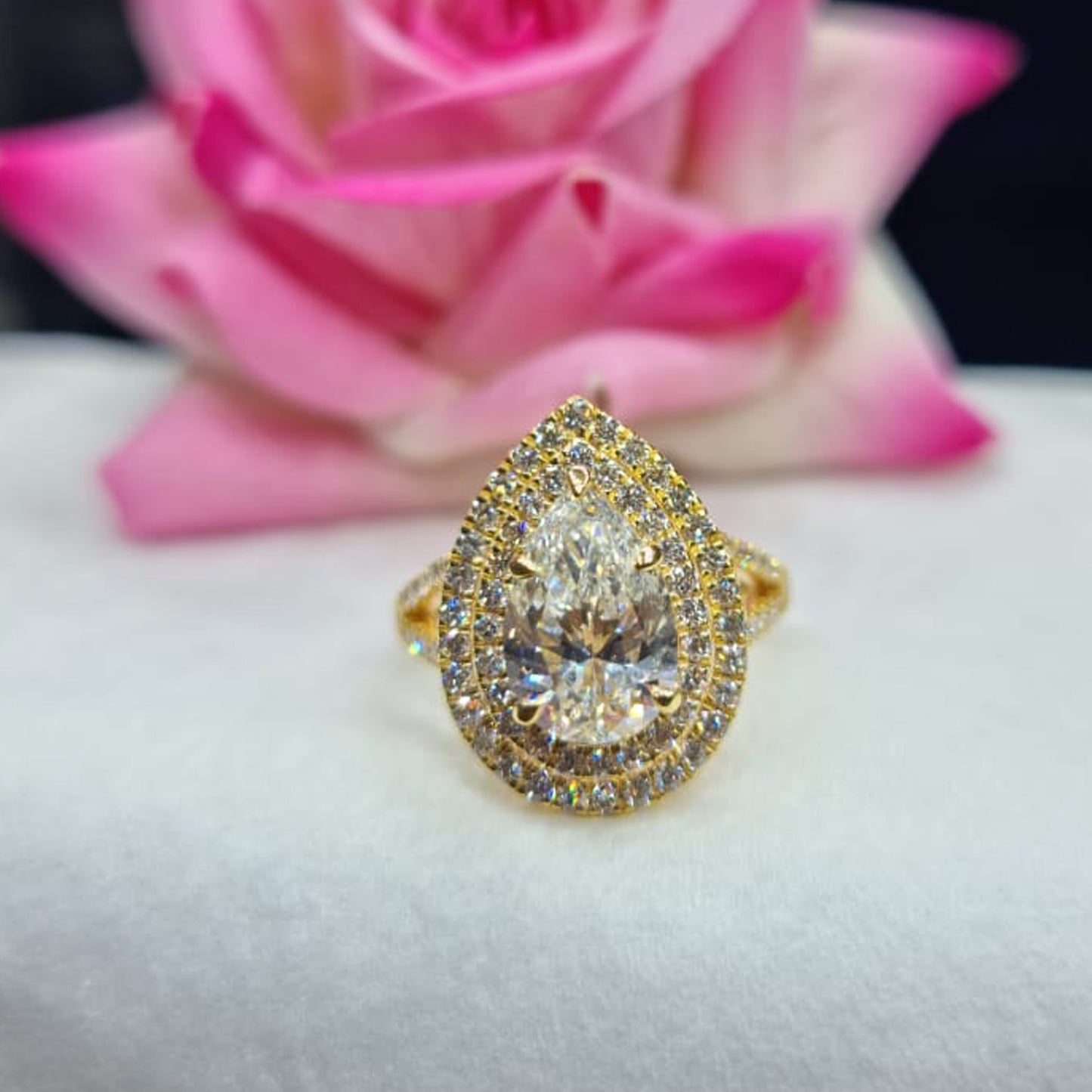 Pear-cut Yellow Diamond Halo Engagement Ring in Platinum