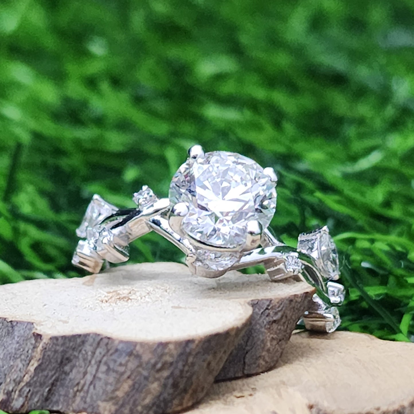 Round-cut Engagement Ring With Set of Marquise cut side Stone